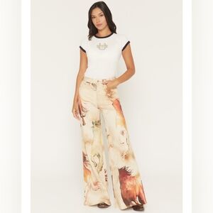 Wrangler x Lainey Wilson high rise flare jeans with multicolor horse print